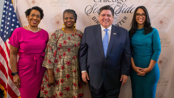 Lieutenant Governor of Illinois Juliana Stratton, Jeanine Valrie Logan, Governor JB Prtizker, and Liz Dozier standing for a group photo at the Chicago South Side Birth Center